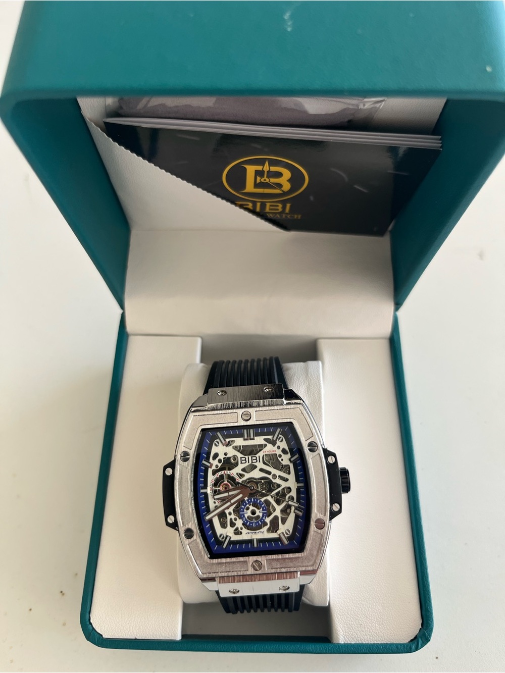 BiBi Men’s Silver Case Skeleton Watch with Blue Accents